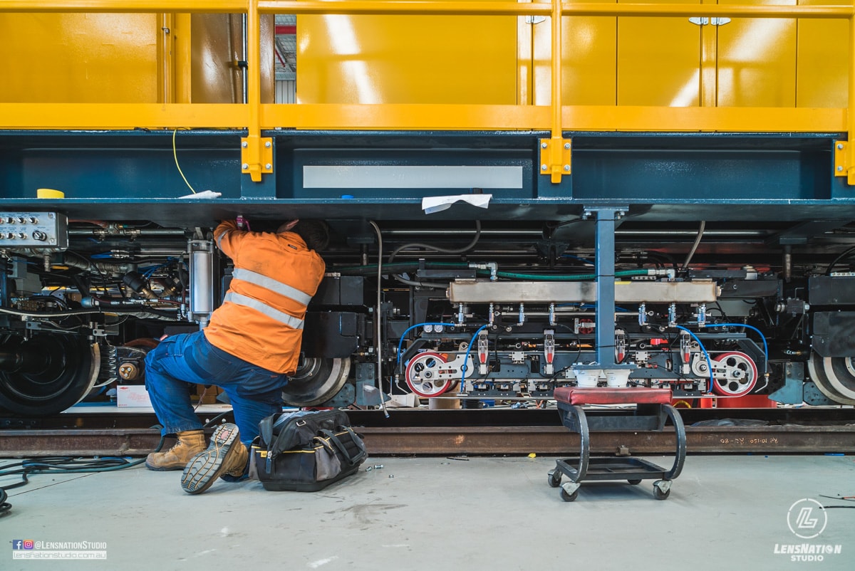 Photographs of lifting and transportation of Speno US7 Rail Maintenance Machine