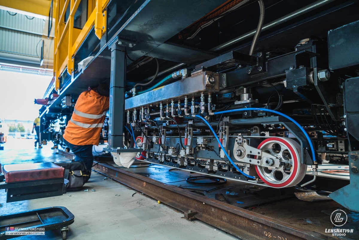 Photographs of lifting and transportation of Speno US7 Rail Maintenance Machine