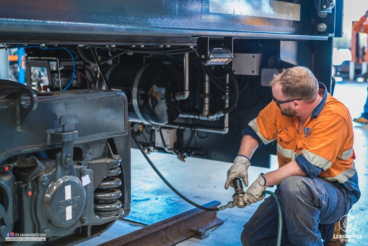Photographs of lifting and transportation of Speno US7 Rail Maintenance Machine