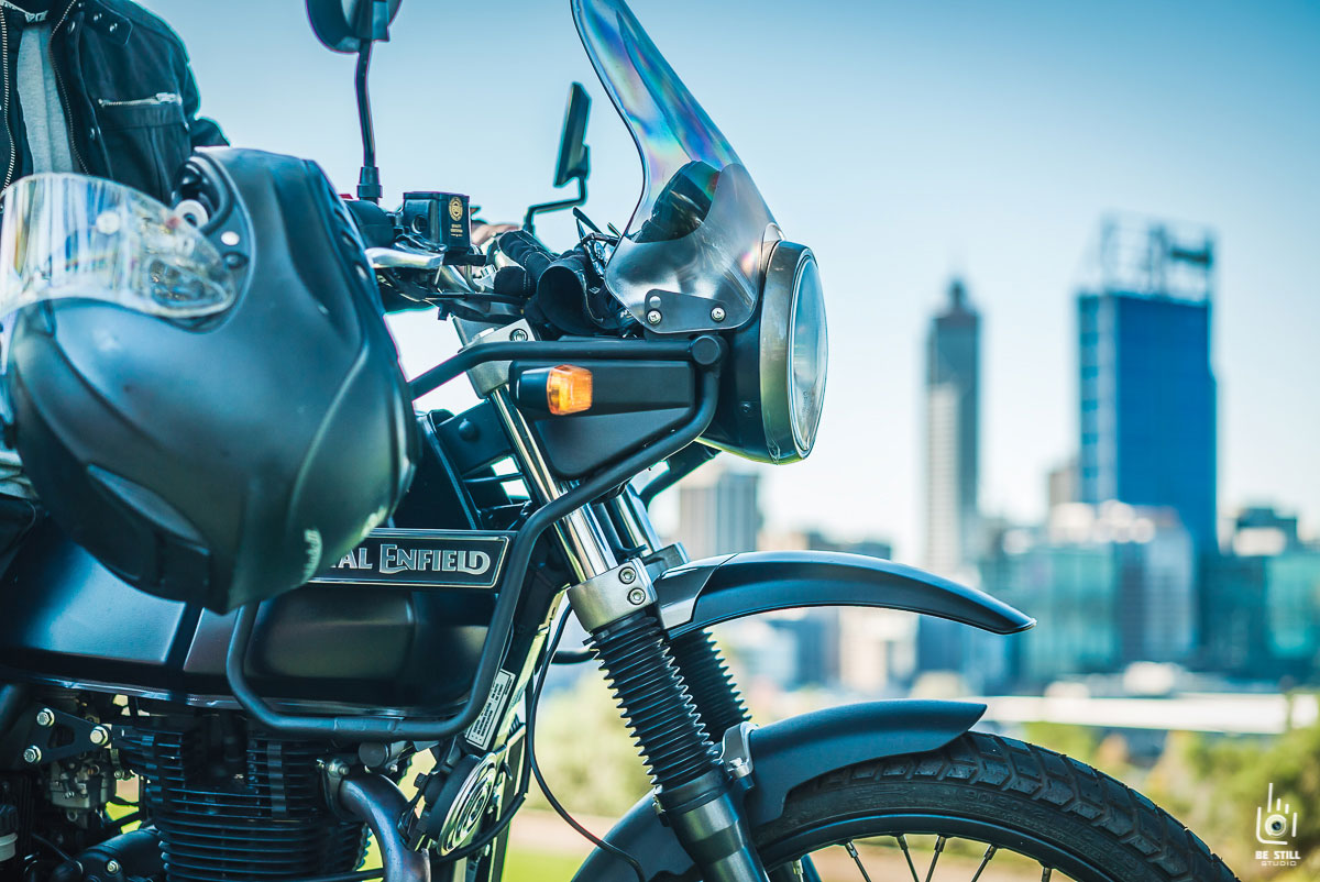 Royal Enfield Himalayan overlooking Perth city skyline