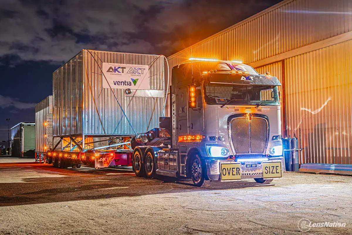 Early morning heavy haulage transport departing Perth depot