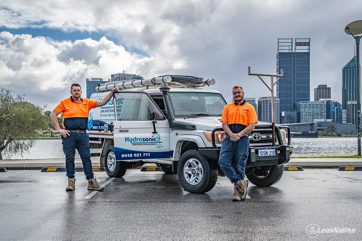 Plumbing service vehicle photographed at South Perth foreshore with city skyline view