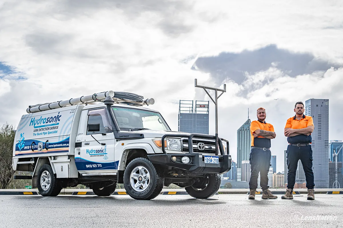 Plumbing service vehicle captured in natural light with Perth skyline behind in South Perth