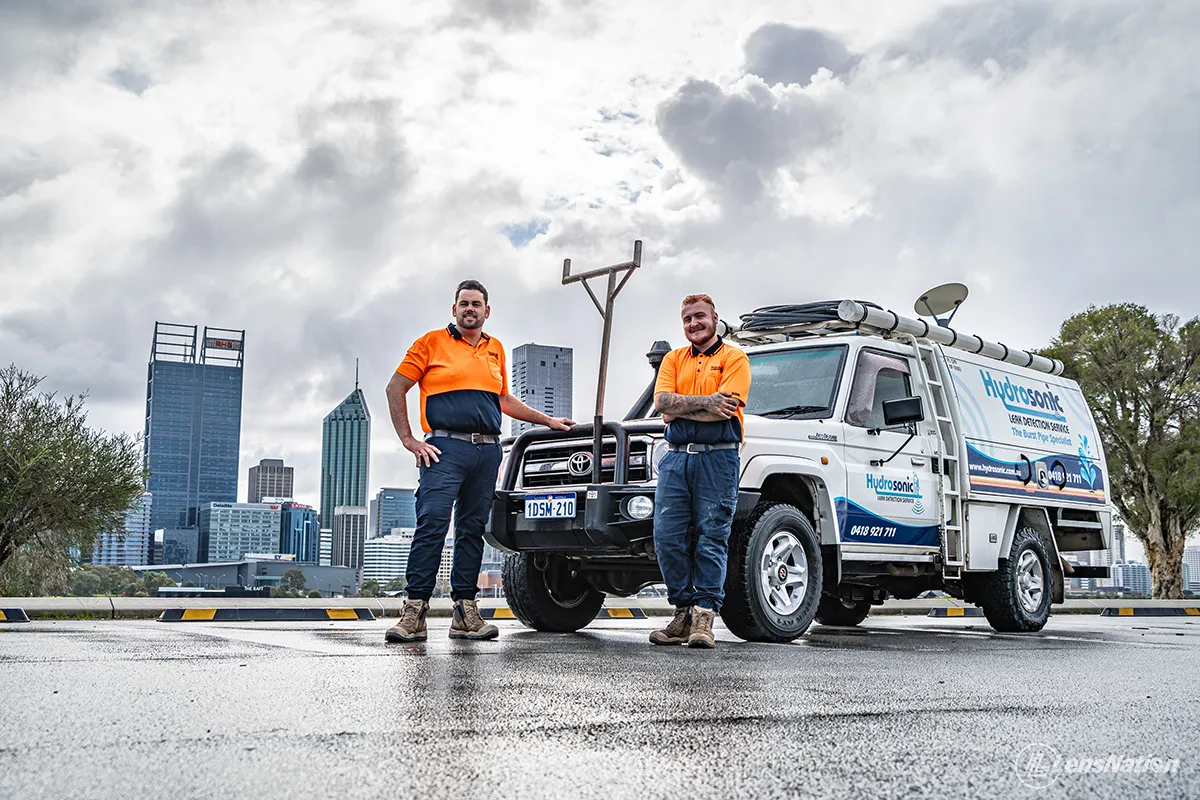 Plumbing company vehicle parked in South Perth with Perth city skyline in the background