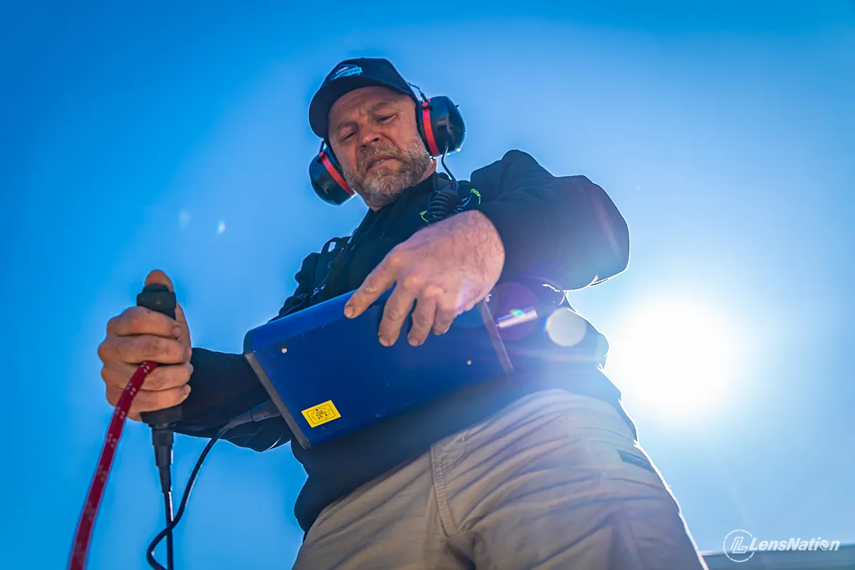 Plumber low angle shot doing the sound leak detection Perth Commercial Photographs