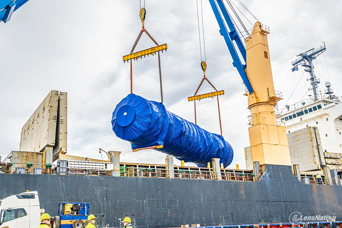 Heavy lift crane lowering mining equipment during cargo unloading in Perth