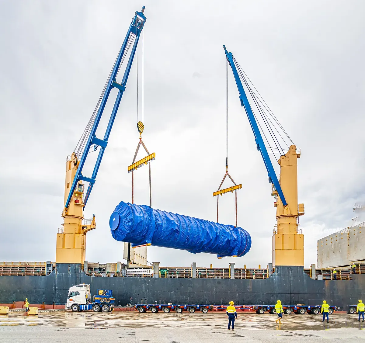 Massive mining equipment being unloaded from a cargo ship at Australian Marine Complex in Perth