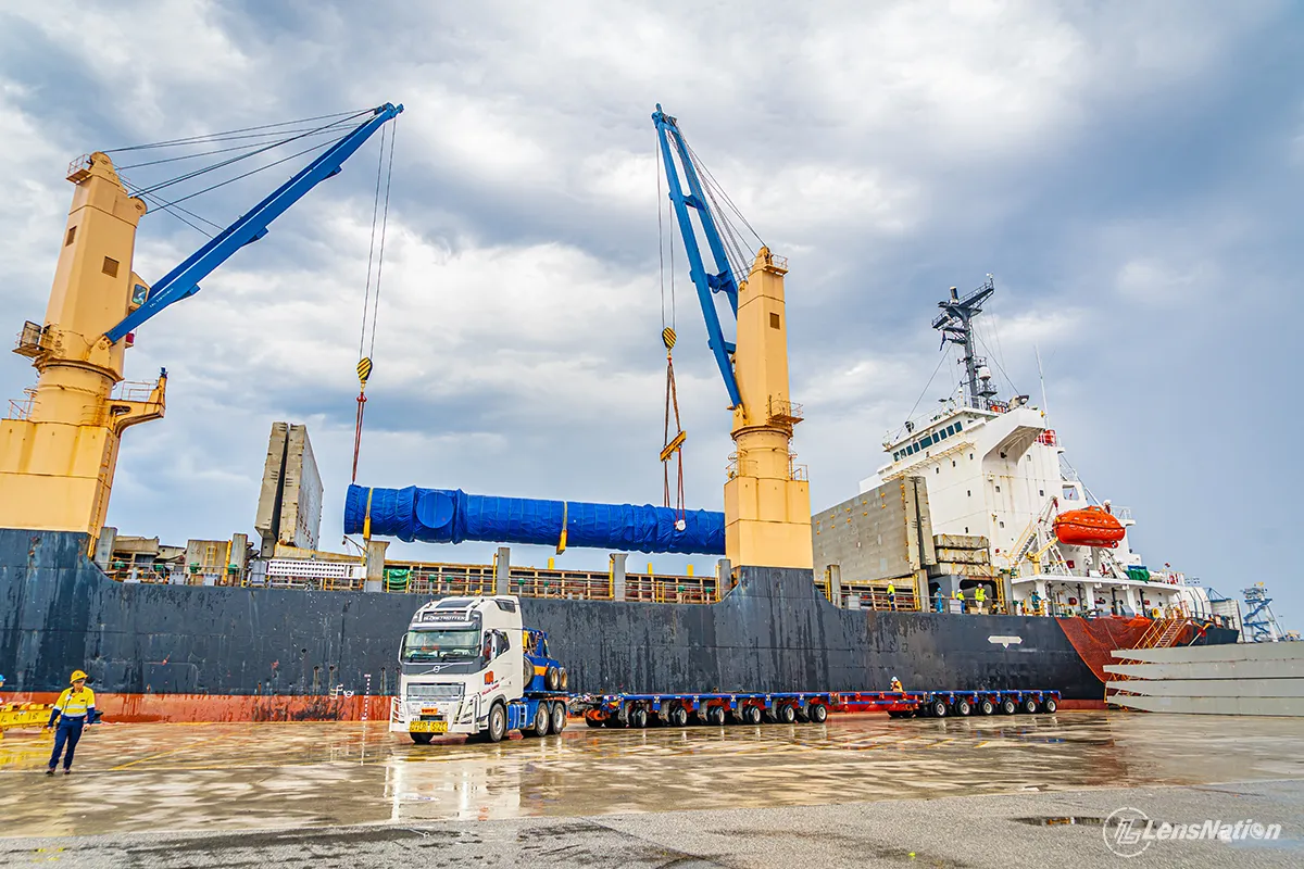 Heavy haulage truck transporting mining equipment after unloading from cargo ship in Perth