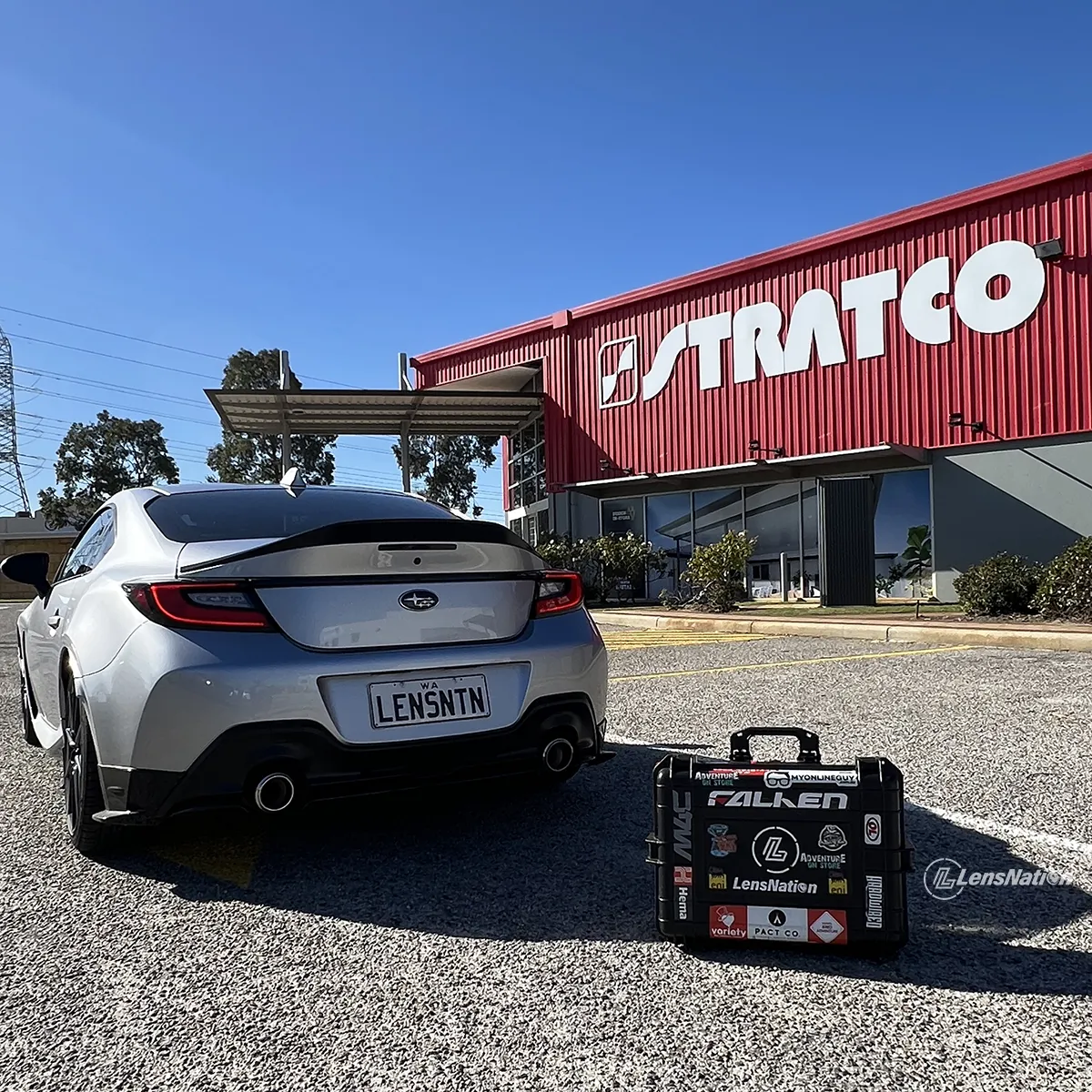LensNation car in front of the Startco Malaga with the camera bag